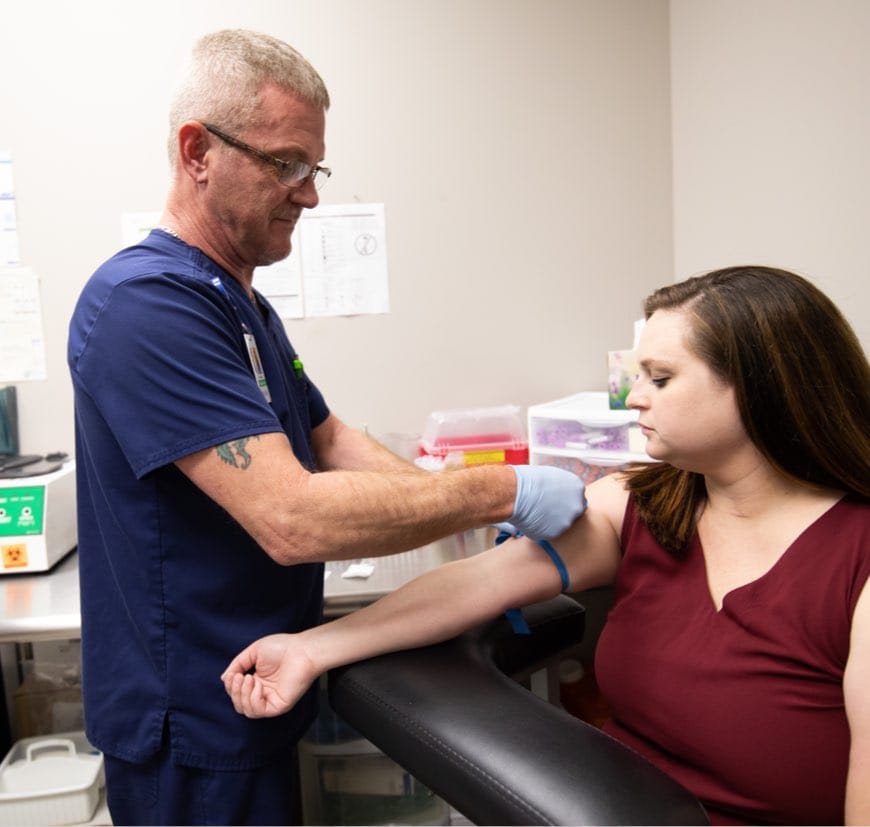 EBO MD provider performing in-office lab testing on patient